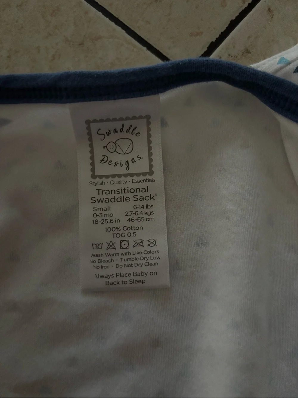 Swaddle Designs transitional sleep sack with blue trim and triangle print